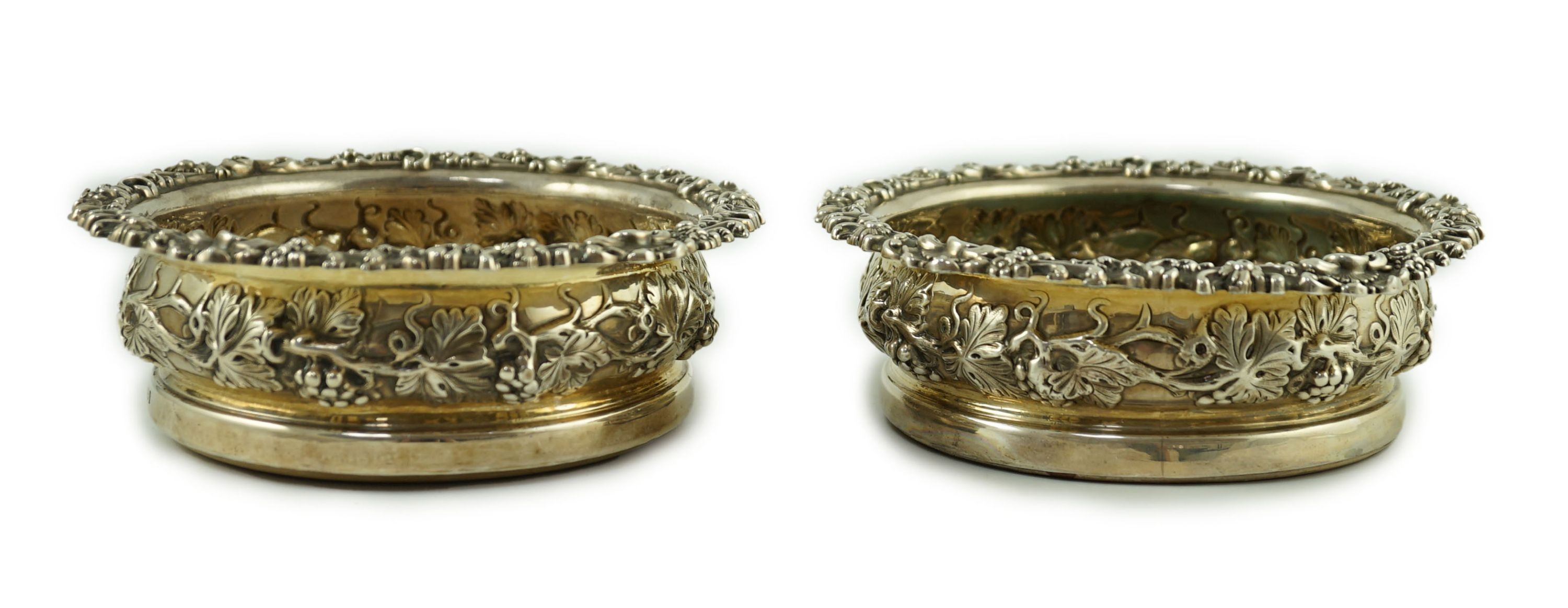 A pair of George IV silver mounted wine coasters, by S.C. Younge & Co